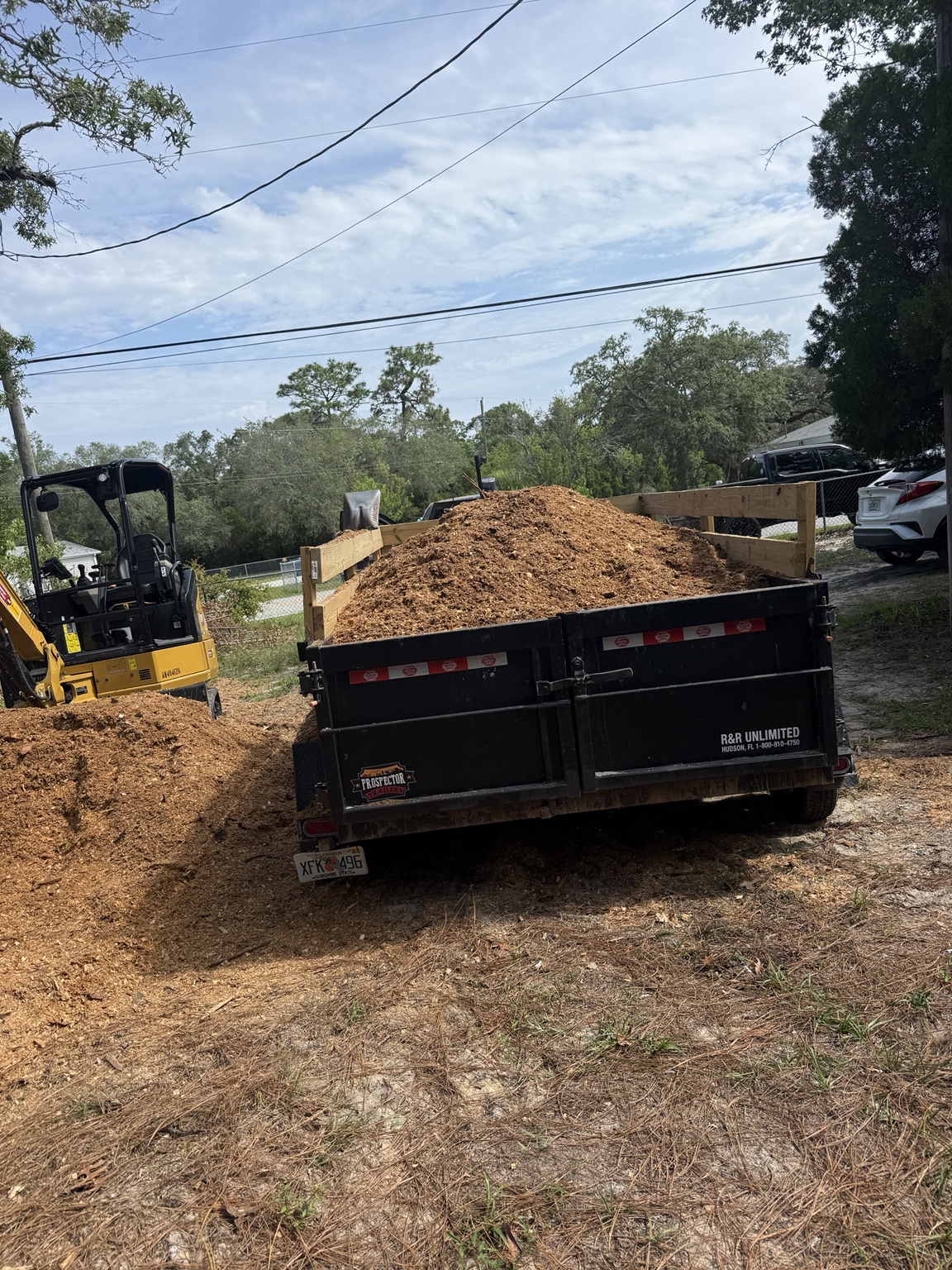 Yard waste loaded for removal by HPS